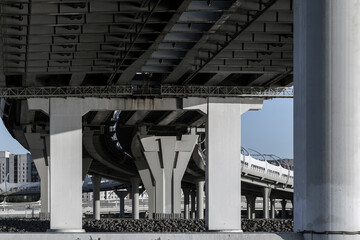 A modern bridge understructure with support pillars and road spans