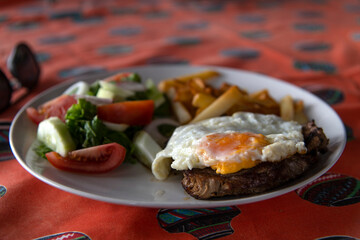 breakfast with salad, egg and steak