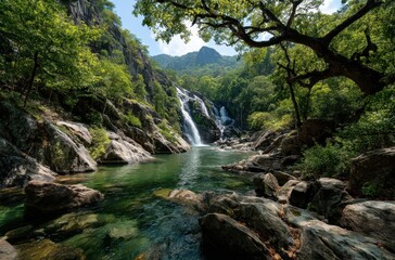 Fototapeta premium Serene Waterfall Cascading into Tranquil Pool Amidst Lush Green Forest and Majestic Mountains Under Clear Blue Sky in Nature's Breathtaking Beauty