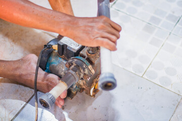 plumber fixing water pipe
