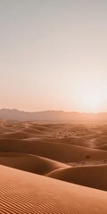 Serene Desert Landscape with Dunes and Soft Sunset Glow