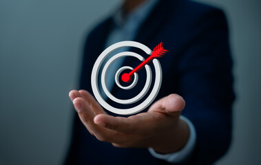 Businessman holding goal icon represent strategic planning, Success. Teamwork, Business strategy, Growth, Marketing focus, Investment planning, Leadership mindset aimed at achieving long-term success.