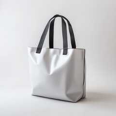 Sleek white tote bag with black handles and trim elegantly displayed against a clean, simple white background for modern fashion and accessories depiction