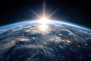 a view of the earth from space with the sun rising