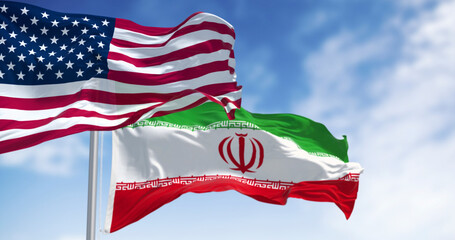 USA and Iran flags waving together.