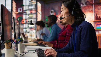 Call center agent using AI chatbot to provide quick and accurate replies to common customer queries. Customer service representative generating automated responses to clients using AI, camera B