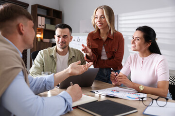 Marketing. Team of businesspeople working together at desk in office
