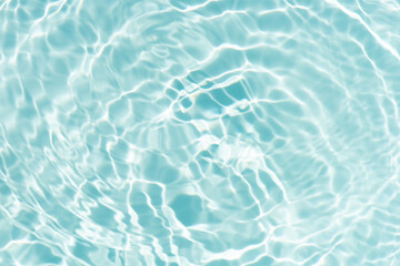 Blue water with ripples on the surface. Defocus blurred transparent blue colored clear calm water...