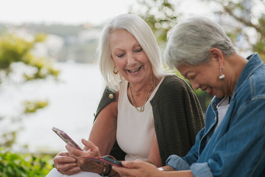 Seniors sharing stories about photos on their phone
