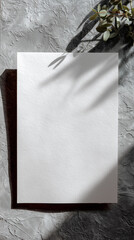 Blank note paper mockup on gray textured surface