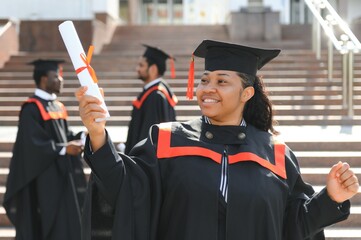 pretty african female college graduate at graduation