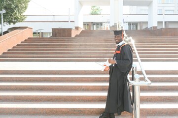 Happy graduate. Happy African man in graduation gowns