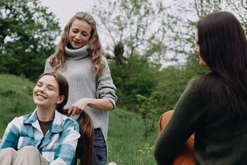 Fototapeta premium Middle age woman enjoying active healthy lifestyle outdoors with community focus on wellbeing and fitness