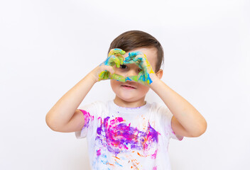 Bright Colors Splash Joy as a Child Creates Art With Paint on His Hands, Expressing Creativity in a...