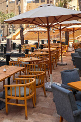 Cafe furniture near the city water channel.