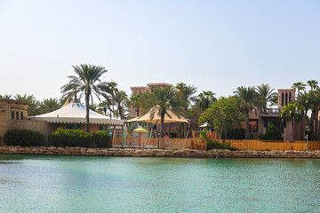 Architecture of the old district of Dubai in oriental style, near water canal.