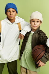 Vibrant friendship shines through as boys sport stylish looks with a basketball in hand