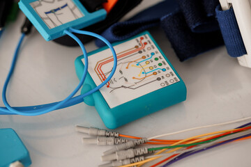 Polysomnography System Setup: Medical Sleep Study Device with Cables, Electrodes, and Blue Color...