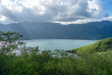 Taiohae Bay and town with anchored sailboats in Nuku Hiva, Marquesas Islands, French Polynesia