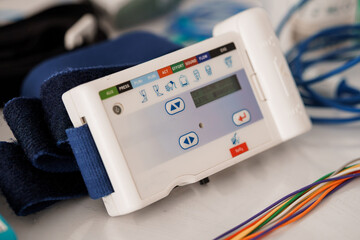 Close-Up of Advanced PSG Sleep Study Machine with Monitor Display and Multi-Colored Cables During...
