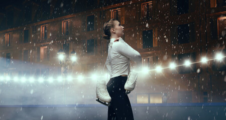 Figure skater woman skating on winter skating ice.