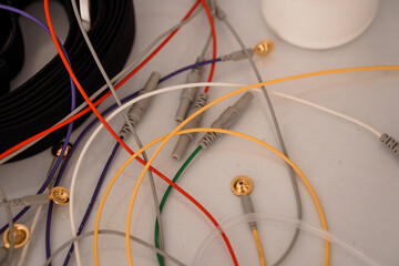 Polysomnography System Wiring Detail: Electrodes, Connectors, White Plastic Base, Black Cable,...