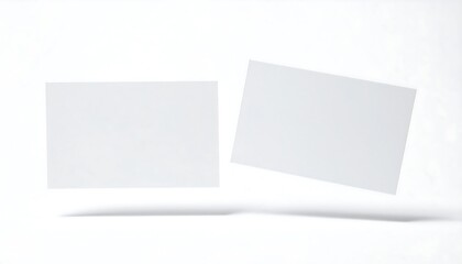 Blank business cards floating on white.