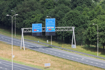 Dutch highway signs near Utrecht indicate directions to major cities and the Jaarbeurs exhibition...