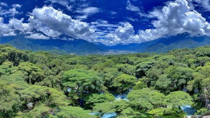 Majestic mountain peaks rise in the background of a lush green landscape enveloped in mist, ideal for nature enthusiasts and stock photography