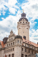 Leipzig, Germany – June 7, 2025: Close-up view of the New Town Hall (Neues Rathaus) with its prominent tower, an architectural landmark in Leipzig built in historicist style. The sandstone facade