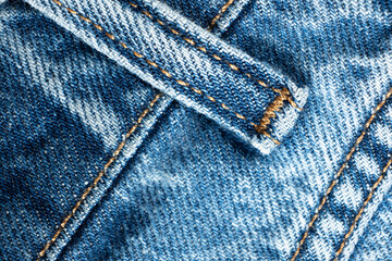 Detailed View of Blue Jeans Fabric and Thread Stitching