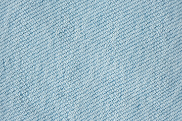Macro Texture Background of Light Blue Jeans Material.