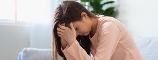 Depression in teenage concept, Young women covering her face feeling anxious and unhappy lock...