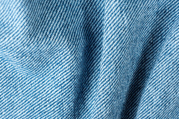Denim Fabric with Organic Folds and Soft Shadows Macro. Pure Cotton Fabric.
