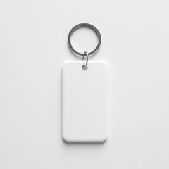Blank white keychain tag with metal ring isolated on light background, customizable promotional accessory for branding, giveaways, souvenirs or identity labeling