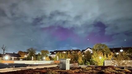 Northern lights over Munich due to an extreme geomagnetic storm on the night of October 10th to...