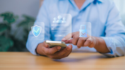 Person holding a smartphone interacts with a transparent overlay showing a login screen with security icons shield, padlock, user profiles. Online security, data protection, and user authentication.
