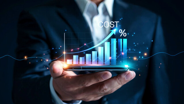 Businessman holding a smartphone displaying a rising bar graph with the word cost and an upward arrow indicating growth and success