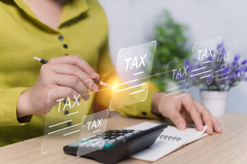 Concepts about paying all types of taxes, calculations for tax reduction planning, women use calculators to calculate income, expenses for sending to the Revenue Department for online inspection.