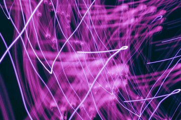 Vibrant light trails dance through the darkness in an electrifying display