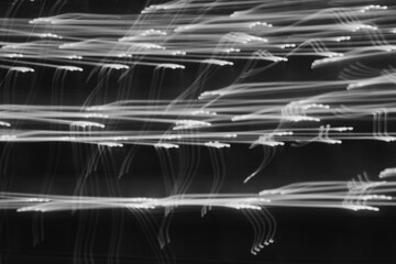 Light trails create an abstract dance of movement in urban nightlife