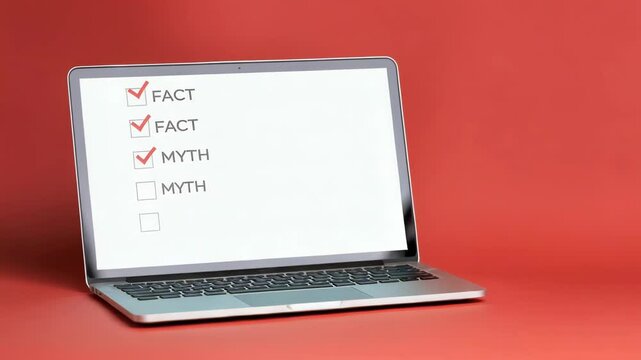 Laptop with fact-checking list featuring "Fact" and "Myth" options on screen