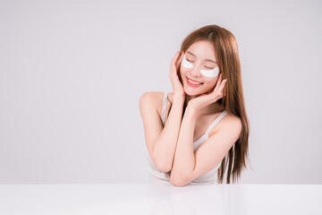 Obraz premium Skin Care Woman Asian Person Smile White Beauty Young Portrait Face Background, Confident and Radiant Female Model with Healthy Skin On White Background