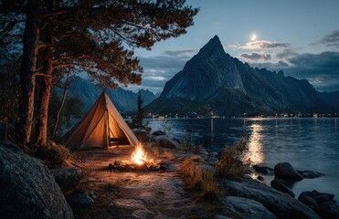 Illuminated tent and campfire by the lake at night, reinebringen, lofoten islands, norway