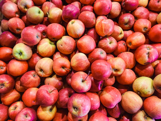 Red apples forming a colorful display at a market stall