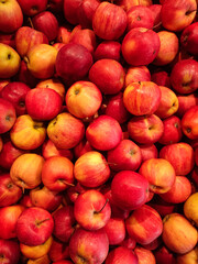 Red apples forming a colorful display at a market