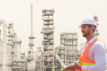Male engineer worker in hard hat inspects work platform on tape measure standing safety inspection...