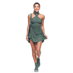 Fototapeta premium Full body portrait of young woman smiling and walking confidently, wearing green dress and sneakers, carrying shoulder bag, expressing happiness and casual style