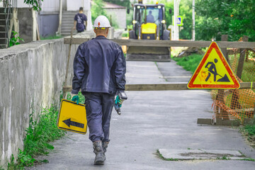 Road works on a narrow street on a summer day