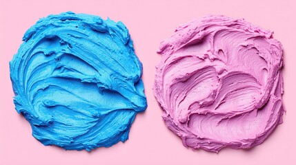 Obraz premium Two dollops of frosting: vibrant blue and soft pink side by side on pink surface